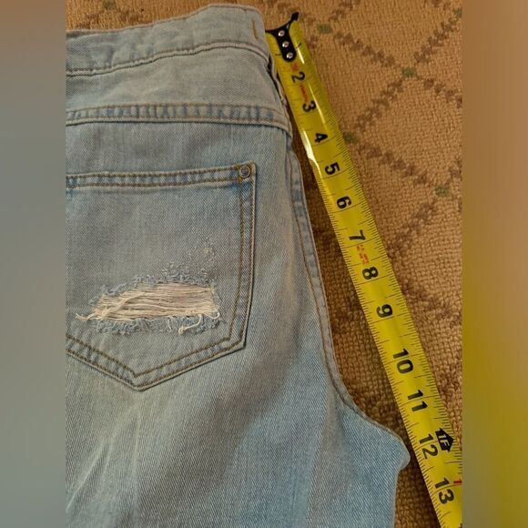 Free People distressed medium wash denim button fly cuffed shorts. 25 - Picture 10 of 12